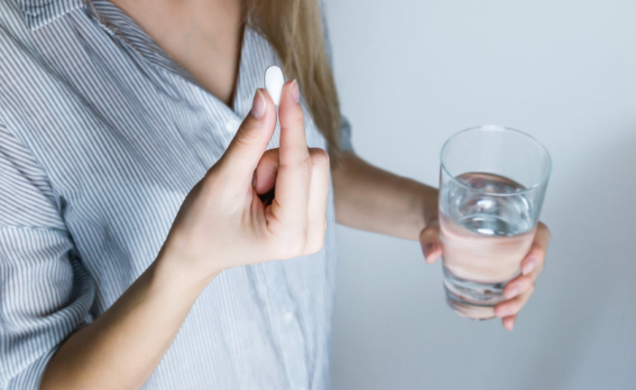 a person taking pill